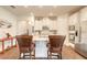 Bright kitchen features white cabinetry, stainless steel appliances, and an island with seating at 2836 Monaghan Dr, Ormond Beach, FL 32174
