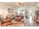 Open living room with plenty of seating and access to the outdoor patio at 2836 Monaghan Dr, Ormond Beach, FL 32174