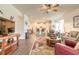 Open-concept living room flowing into the kitchen, featuring modern furnishings and neutral tones at 2836 Monaghan Dr, Ormond Beach, FL 32174