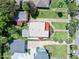 This home features a well-maintained roof, a spacious backyard, and it's surrounded by a lush landscape at 918 N Wild Olive Ave, Daytona Beach, FL 32118
