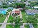 Aerial view of a charming home featuring mature trees, landscaping and convenient street access at 918 N Wild Olive Ave, Daytona Beach, FL 32118