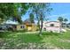 Spacious backyard surrounded by mature trees, providing privacy and shade for outdoor activities and relaxation at 918 N Wild Olive Ave, Daytona Beach, FL 32118