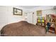 Comfortable bedroom with a large bed and bookshelves for storage and decoration at 918 N Wild Olive Ave, Daytona Beach, FL 32118
