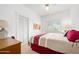 Bright bedroom with a comfortable bed and ample natural light from large windows at 918 N Wild Olive Ave, Daytona Beach, FL 32118