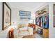 Relaxing bedroom space features a cozy armchair, stylish décor, and convenient closet storage at 918 N Wild Olive Ave, Daytona Beach, FL 32118