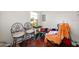 Bonus room featuring hardwood floors, natural light, and stylish metal chairs at 918 N Wild Olive Ave, Daytona Beach, FL 32118