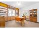 Cozy dining room with custom built-in bookshelves, a vintage hutch and a charming drop-leaf dining table at 918 N Wild Olive Ave, Daytona Beach, FL 32118