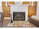 Detailed view of the living room fireplace, with brick surround and hearth decor at 918 N Wild Olive Ave, Daytona Beach, FL 32118