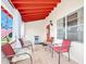 Inviting front porch with red ceiling, tile flooring, and comfortable seating perfect for relaxing at 918 N Wild Olive Ave, Daytona Beach, FL 32118