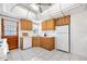 Traditional kitchen with wood cabinets, tile floors, and access to the outside at 918 N Wild Olive Ave, Daytona Beach, FL 32118