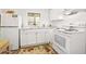 Bright white kitchen features updated appliances, marble countertops, and ample cabinet space at 918 N Wild Olive Ave, Daytona Beach, FL 32118