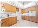 Quaint kitchen featuring wood cabinets and neutral countertops at 918 N Wild Olive Ave, Daytona Beach, FL 32118