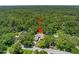 Aerial view of home surrounded by lush green trees and a pool at 1108 Northside Dr, Ormond Beach, FL 32174