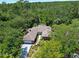 Aerial view of a brick single story home surrounded by mature trees at 1108 Northside Dr, Ormond Beach, FL 32174