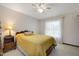 Comfortable bedroom with carpet, a ceiling fan, and a bright window, creating a serene atmosphere at 1108 Northside Dr, Ormond Beach, FL 32174