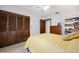 Spacious bedroom includes carpet, a ceiling fan, built-in shelves and ample closet space at 1108 Northside Dr, Ormond Beach, FL 32174