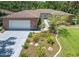 Beautiful single story brick home featuring a large driveway and manicured lawn at 1108 Northside Dr, Ormond Beach, FL 32174