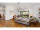 Living room with hardwood floors, light walls, and view into the sunroom at 1108 Northside Dr, Ormond Beach, FL 32174