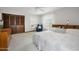Bright main bedroom featuring a neutral color palette, carpet, and a ceiling fan for added comfort at 1108 Northside Dr, Ormond Beach, FL 32174