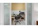 Office space features a desk, rolling chair, and frosted glass doors at 1108 Northside Dr, Ormond Beach, FL 32174