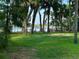 Backyard with trees and a dock at 1162 Carmel Cir # 100, Casselberry, FL 32707