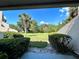 Beautiful view of a lush, green backyard with blue sky in the distance at 1162 Carmel Cir # 100, Casselberry, FL 32707