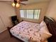 Bedroom featuring a ceiling fan and natural light from a window, creating a peaceful retreat at 1162 Carmel Cir # 100, Casselberry, FL 32707
