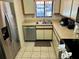 Charming kitchen features stainless steel appliances and light countertops at 1162 Carmel Cir # 100, Casselberry, FL 32707