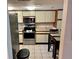 View of kitchen featuring stainless steel appliances and eating area at 1162 Carmel Cir # 100, Casselberry, FL 32707