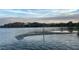 Scenic lake view with a small island and lush trees along the shoreline under a cloudy sky, offering a peaceful vista at 1162 Carmel Cir # 100, Casselberry, FL 32707