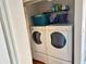 Laundry room with washer and dryer and overhead shelving at 1162 Carmel Cir # 100, Casselberry, FL 32707