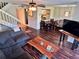 Inviting living room with stairs to upper level, open floor plan and hardwood floors at 1162 Carmel Cir # 100, Casselberry, FL 32707