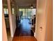 View of living room through door with staircase and hardwood floors at 1162 Carmel Cir # 100, Casselberry, FL 32707