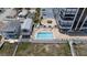 Aerial view of an upscale condo complex next to the beach featuring a community pool and courtyard at 1239 Ocean Shore Blvd # 3C3, Ormond Beach, FL 32176