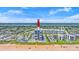Aerial view of the building and amenities, including beach access and community pool at 1239 Ocean Shore Blvd # 3C3, Ormond Beach, FL 32176