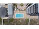 Aerial view of a community pool, courtyard, and balconies on an upscale condo complex next to the beach at 1239 Ocean Shore Blvd # 3C3, Ormond Beach, FL 32176