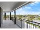 Spacious balcony with black iron railings, perfect for enjoying the city views and the beautiful sky at 1239 Ocean Shore Blvd # 3C3, Ormond Beach, FL 32176