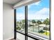 Ocean view from window overlooking palm trees and parking at 1239 Ocean Shore Blvd # 3C3, Ormond Beach, FL 32176