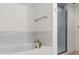 Bathroom showcasing a soaking tub and a shower with glass doors at 1239 Ocean Shore Blvd # 3C3, Ormond Beach, FL 32176