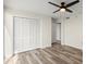 Bedroom with hardwood flooring, closet and ceiling fan at 1239 Ocean Shore Blvd # 3C3, Ormond Beach, FL 32176