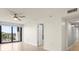 Bright room with wood floors, ceiling fan and balcony access at 1239 Ocean Shore Blvd # 3C3, Ormond Beach, FL 32176