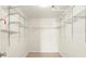 Walk-in closet with custom shelving and wood floors at 1239 Ocean Shore Blvd # 3C3, Ormond Beach, FL 32176