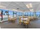 Common area featuring multiple tables with chairs and ocean views at 1239 Ocean Shore Blvd # 3C3, Ormond Beach, FL 32176