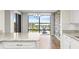 Bright dining area with stone accent wall and outdoor views at 1239 Ocean Shore Blvd # 3C3, Ormond Beach, FL 32176