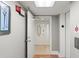 Hallway leading to unit entrance with a door featuring decorative glass and an elevator on the side at 1239 Ocean Shore Blvd # 3C3, Ormond Beach, FL 32176