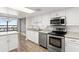 Bright and airy kitchen with stainless steel appliances and a view of the city at 1239 Ocean Shore Blvd # 3C3, Ormond Beach, FL 32176