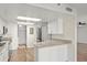 Bright kitchen features granite countertops and stainless steel appliances at 1239 Ocean Shore Blvd # 3C3, Ormond Beach, FL 32176