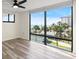 Bright living room features wood floors, ceiling fan and large windows overlooking the beach at 1239 Ocean Shore Blvd # 3C3, Ormond Beach, FL 32176