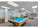Well lit recreation room with billiards table, ping pong table, and sitting area at 1239 Ocean Shore Blvd # 3C3, Ormond Beach, FL 32176