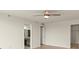 Open room near hall with ceiling fan, view to bathroom and bedroom at 1239 Ocean Shore Blvd # 3C3, Ormond Beach, FL 32176